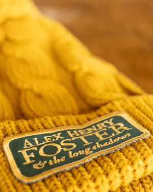 “Perpetual Glimmer” Pompom Cable-Knit Beanie - Golden Yellow